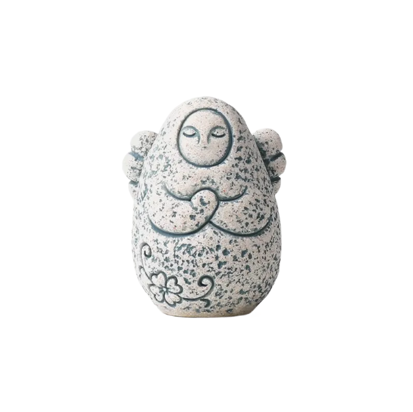 Speckled gray stone guardian ornament with closed eyes and clasped hands