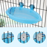 Blue bird bath with round mirror mounted on cage bars and hook hardware closeups