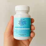 Canine reproduction supplement bottle held in a hand, blue label facing forward