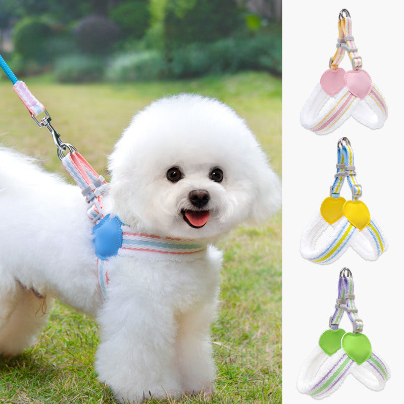 Breathable dog chest harness with pink heart pad and striped leash, on small white dog