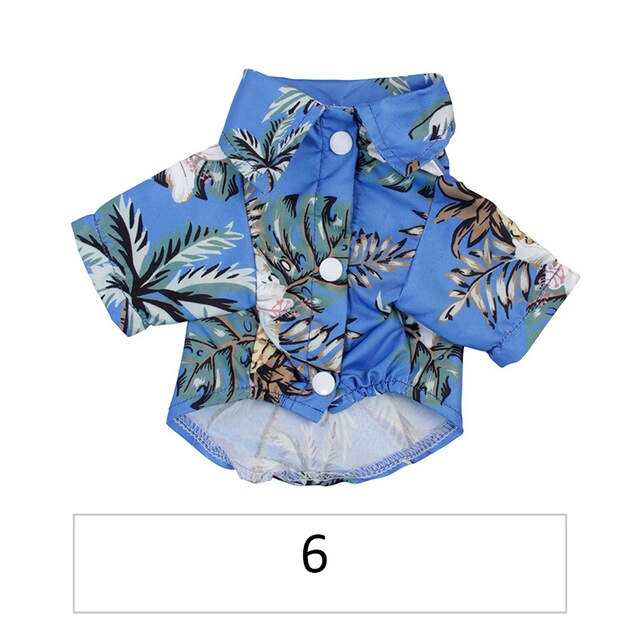 Hawaiian pet shirt in bright blue with tropical leaf and animal prints, button front