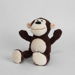 Brown and white monkey plush pet toy with curled tail and round stitched face