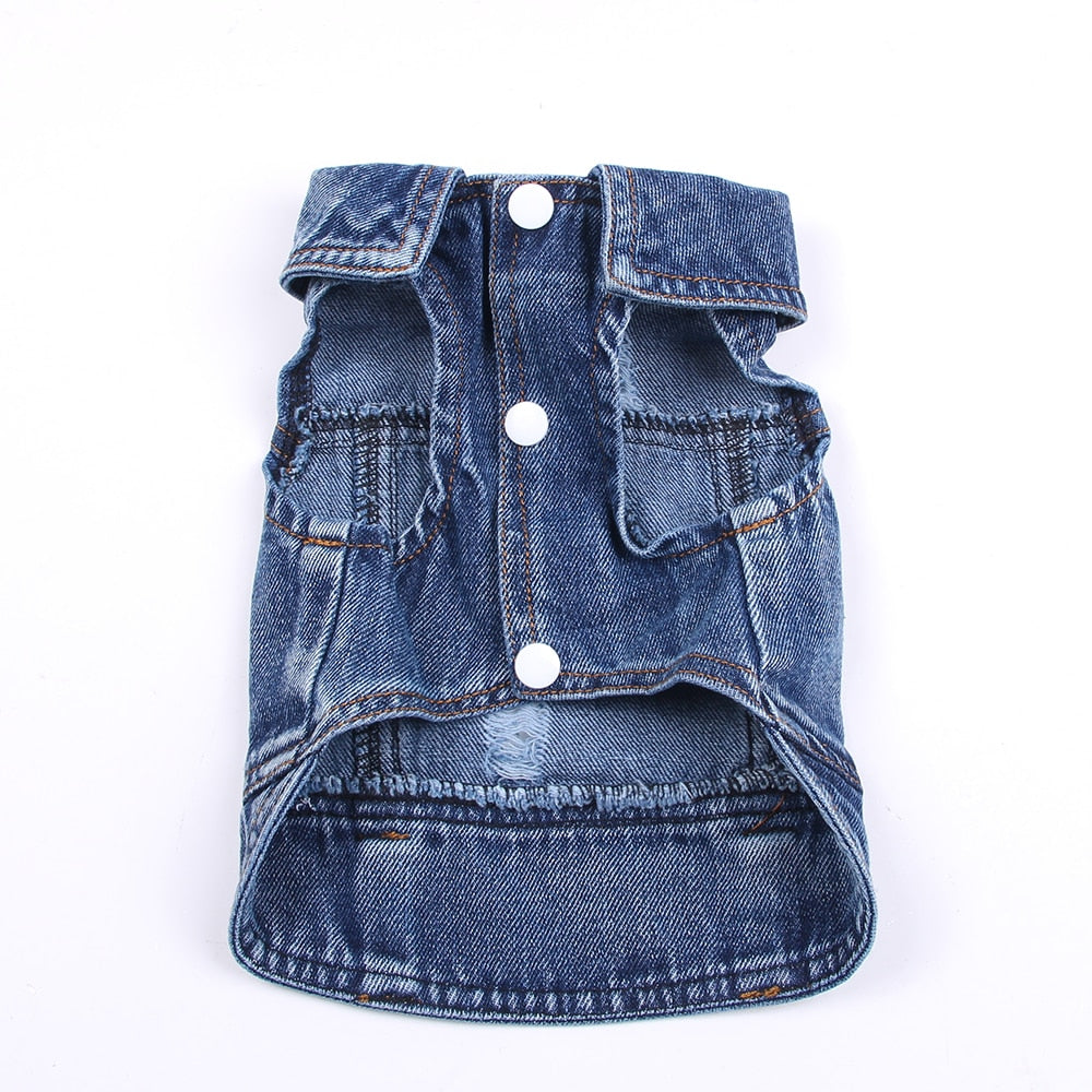 Blue denim pet jacket with snap buttons, flap pockets, and frayed hem edge