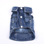 Blue denim pet jacket with snap buttons, flap pockets, and frayed hem edge
