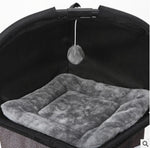 Cat climbing tree cushion bed with gray plush insert under arched fabric cover.