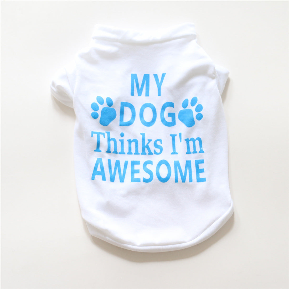 White cotton dog summer vest with paw logo and “My dog Thinks I’m Awesome” print