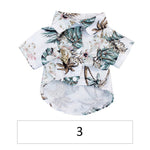 Hawaiian pet shirt, light base with teal and tan tropical leaf prints, button front