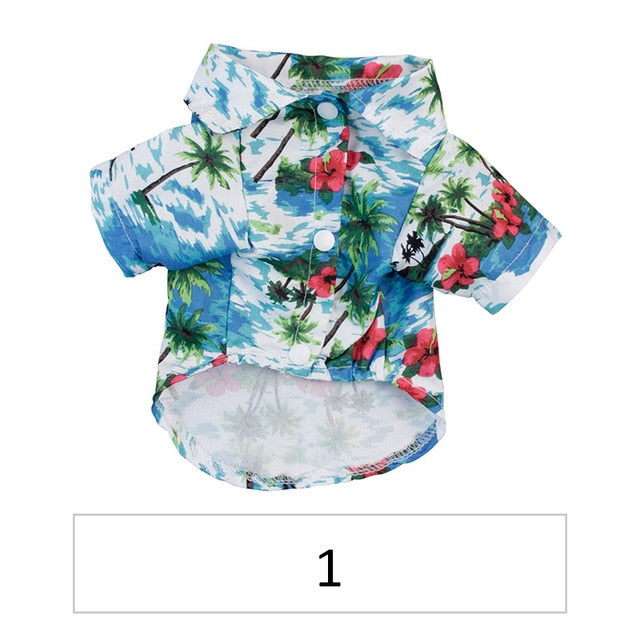 Hawaiian pet shirt, light blue with palm and red flower prints, button front and short sleeves