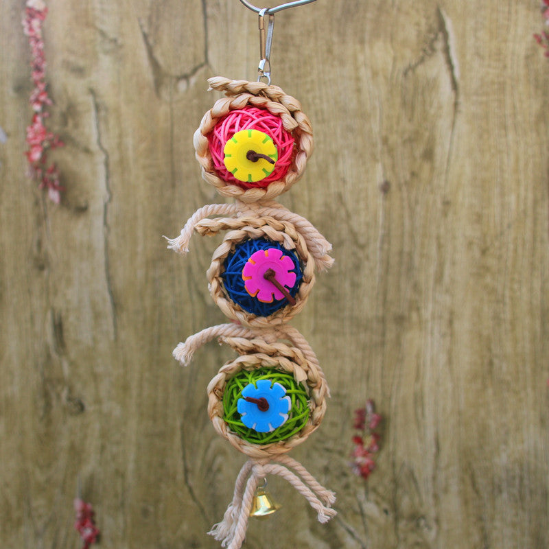 Hanging bird rope toy with three braided balls, colorful gear wheels, and a small bell