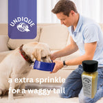 Quail egg food topper bottle with black cap as a person sprinkles for a dog