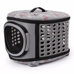 Foldable pet carrier handbag in gray with vented side panels and mesh window