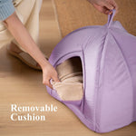 Lavender foldable cat house bed cushion being inserted by hand