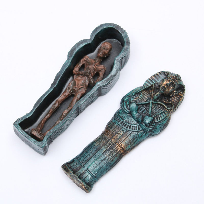 Mummy coffin fish tank ornament—open teal coffin holding wrapped mummy remains