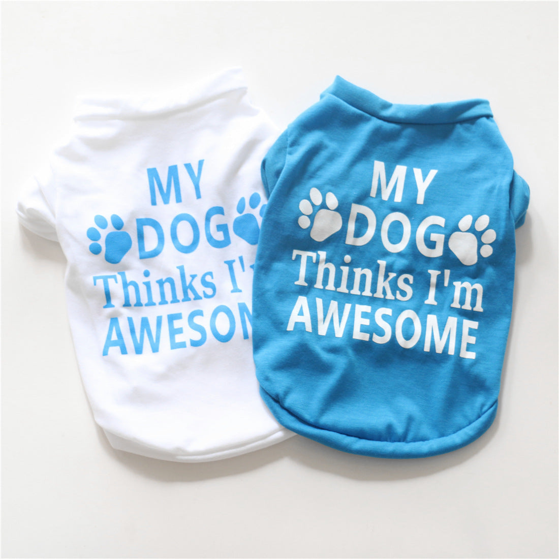 Blue and white cotton dog summer vest with paw and “My dog Thinks I’m Awesome” print