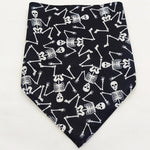 Black pet triangle bandana with white skeleton bones and skulls all over