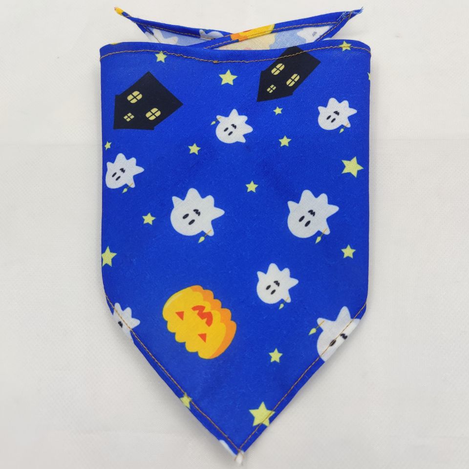Pet triangle bandana in bright blue with yellow stars, white ghost faces, and small house icons
