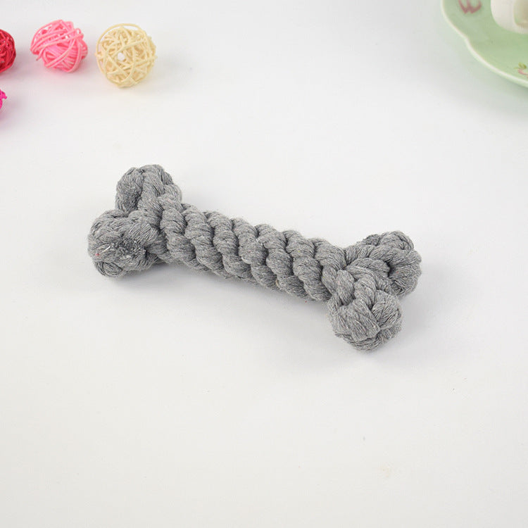 Grey crocheted dog bone toy with knotted ends
