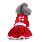 Red holiday dog dress with white trim, bow details, and fluffy skirt