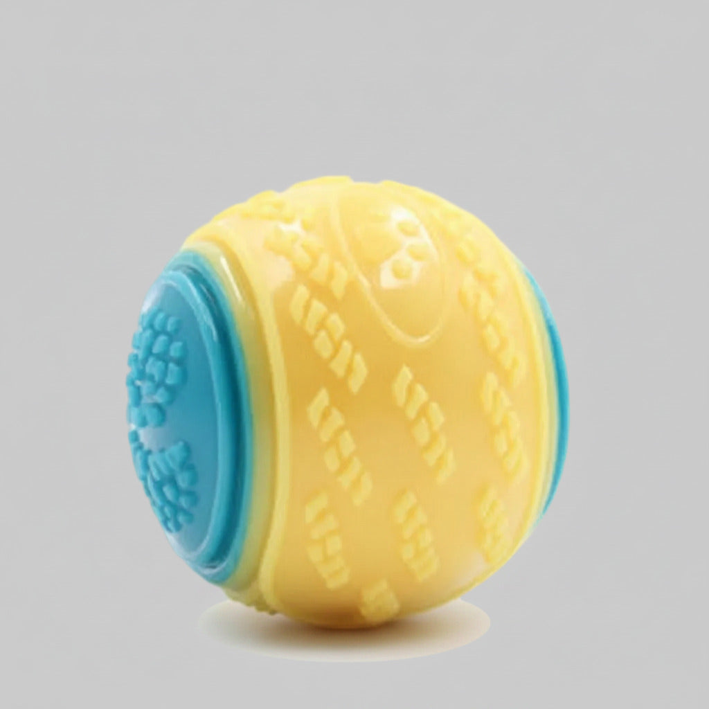 Dog training ball toy with yellow and blue textured halves