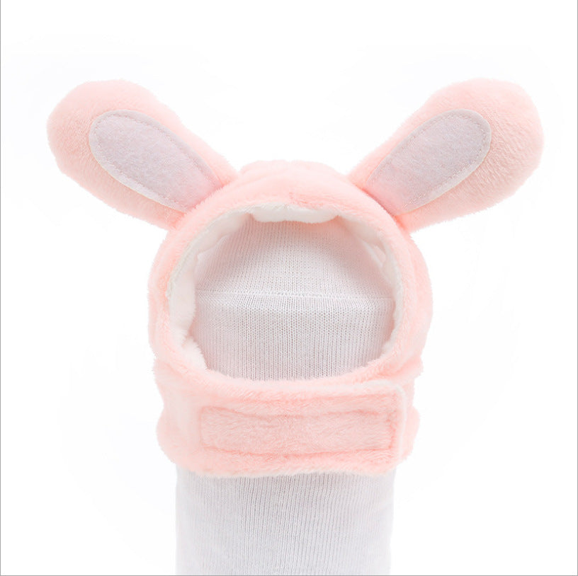 Pink rabbit plush pet hat with floppy ears and soft hood