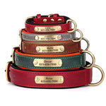 Stack of personalized dog collars with engraved name plates and metal rings