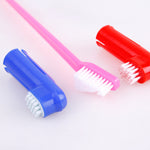 Pet finger toothbrushes with pink, blue, and red handles and soft bristles