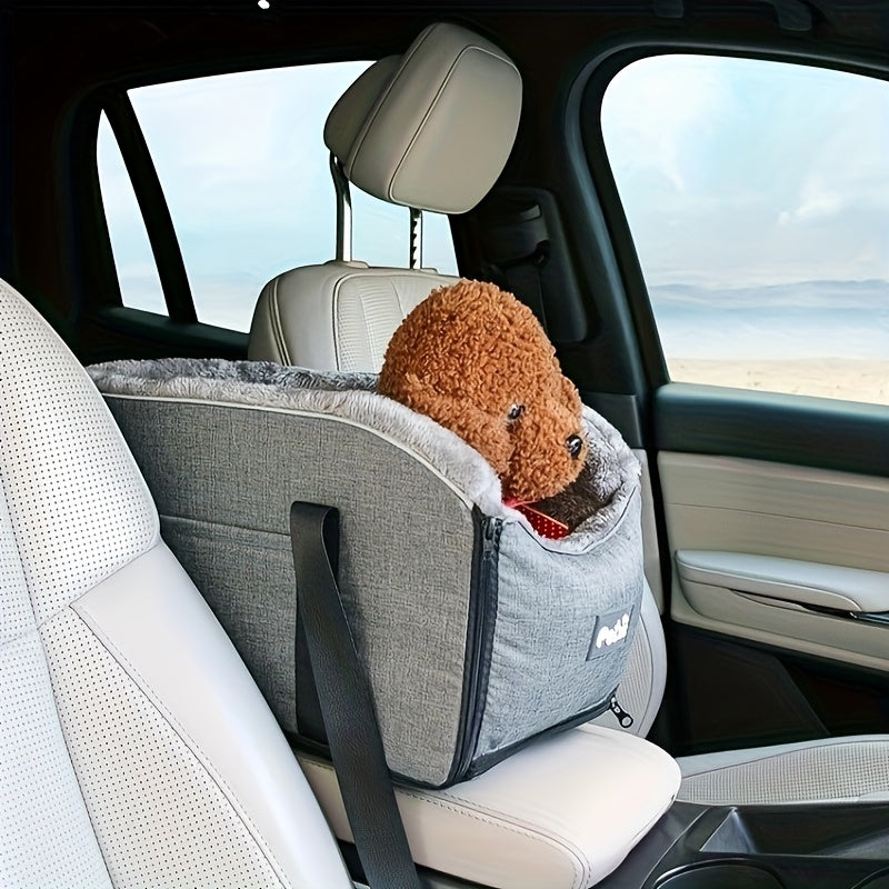 Small brown dog resting in grey pet car seat with plush edge and side safety strap