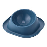 Dark blue tilted cat food bowl with molded inner dish