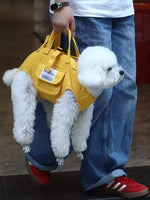 Gold portable pet carrier harness with shoulder strap and small front pocket