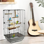 Natural wood bird perch set mounted in a wire cage with several branch perches