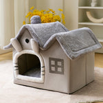 Light gray enclosed pet house bed with plush animal head detail and arched door