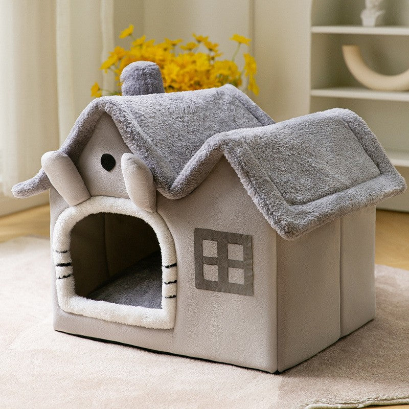 Light gray enclosed pet house bed with plush animal head detail and arched door