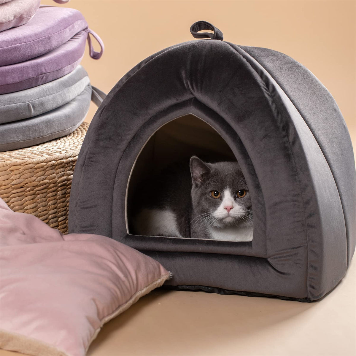 Dark gray arched cat bed cushion with plush lining; cat inside the doorway