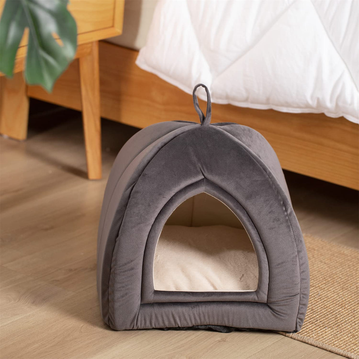 Dark grey pet tent bed with arched front opening and carrying loop