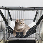 Cat cage hanging hammock bed with dark star fabric, plush white lining, and straps