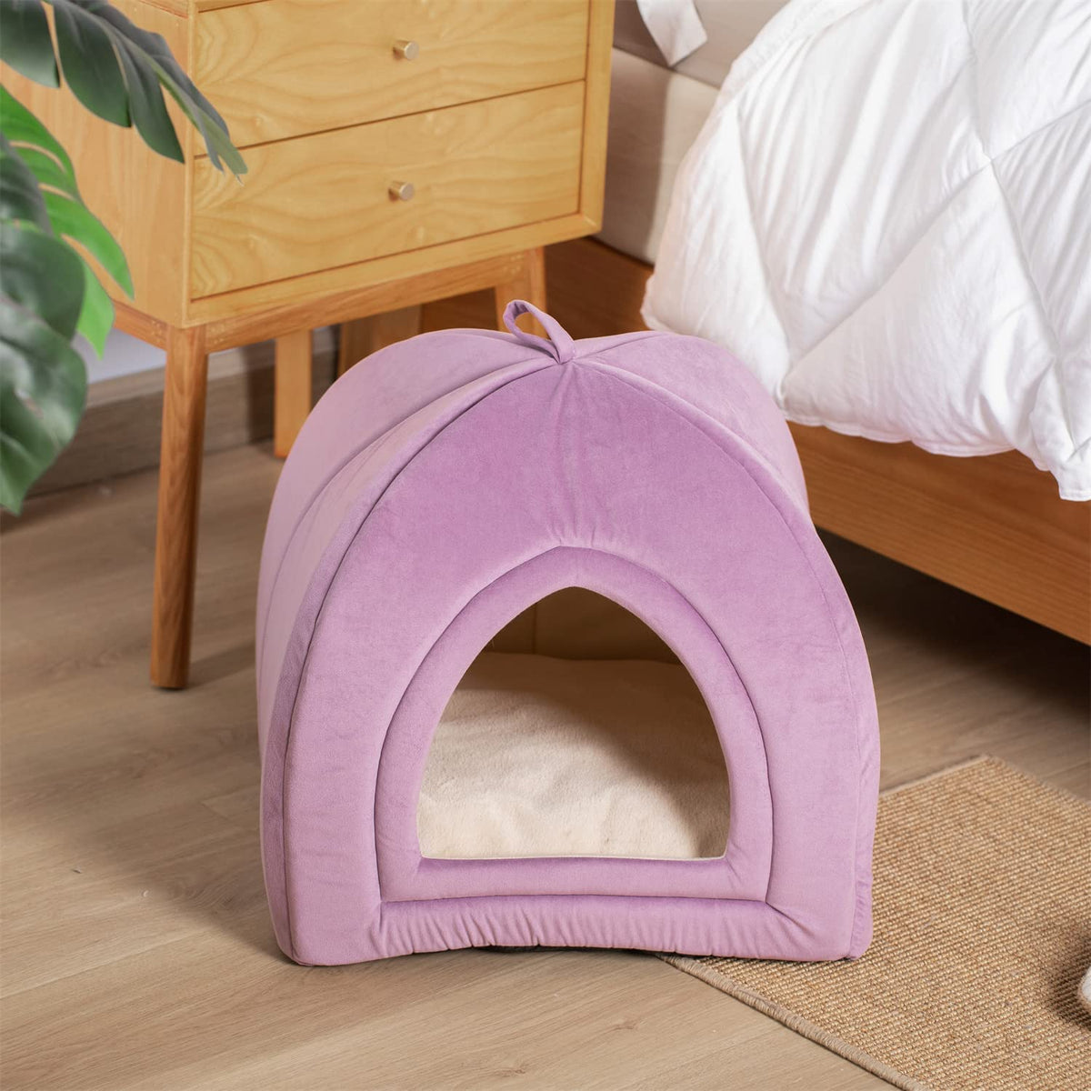 Purple plush pet tent bed with arched entrance and padded base