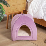 Purple plush pet tent bed with arched entrance and padded base