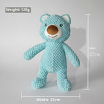 Light blue plush bear-shaped pet toy with stitched smile and rounded ears