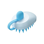 Silicone pet hair remover comb with light blue body and blue bristles, handheld grooming brush