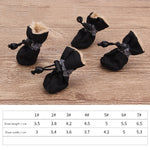 Black dog soft-soled pet shoes with ruffled lining and lace cord toggles
