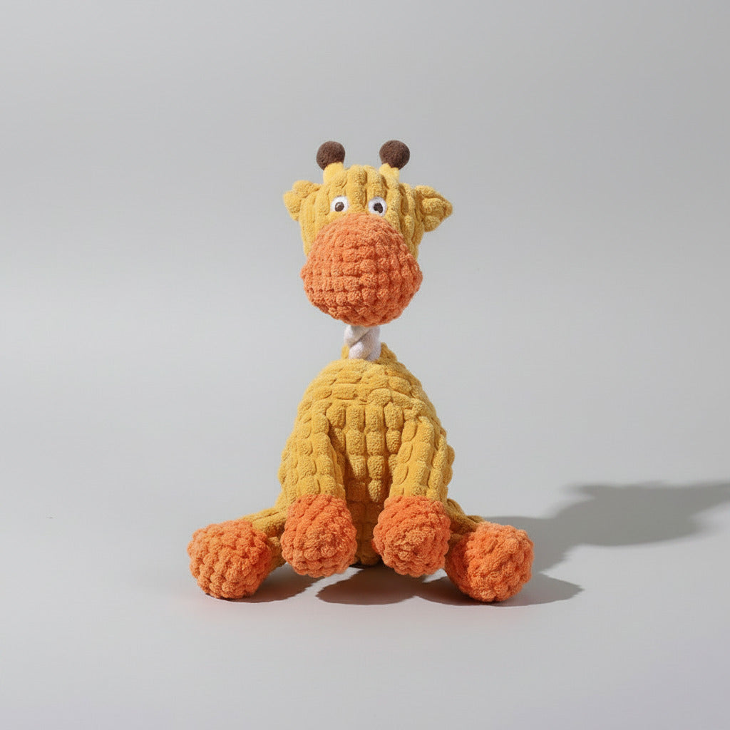 Plush squeaky giraffe dog toy in orange with brown horns and round ears.