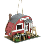 Red trailer-style birdhouse with gray roof, open doorway, and small porch steps