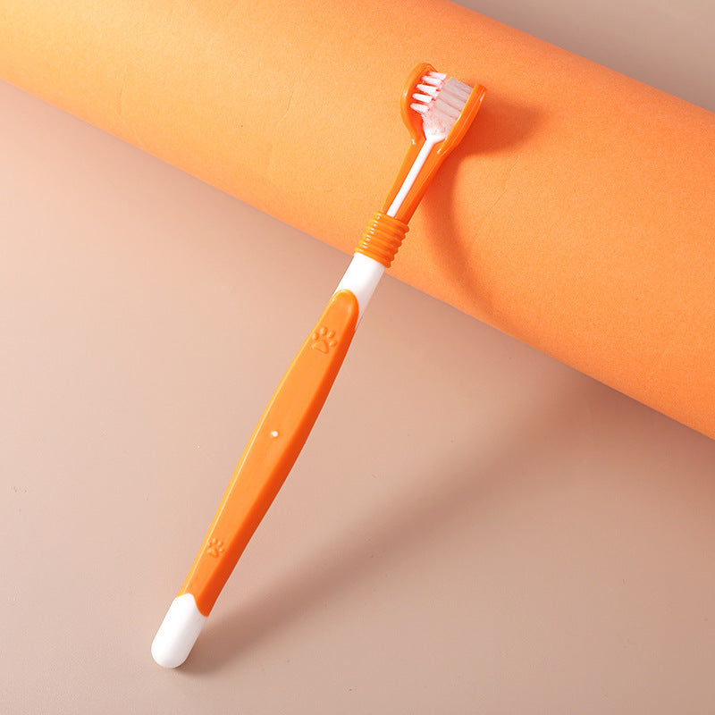 Orange three-sided pet toothbrush with white grip base and bristled head
