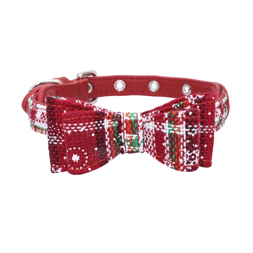 Red pet collar with white check bow and green trim, plus silver grommet studs