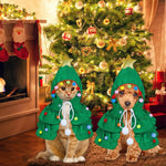 Two pets wearing green Christmas tree hooded costumes with gold star, colorful pom-poms, and ties