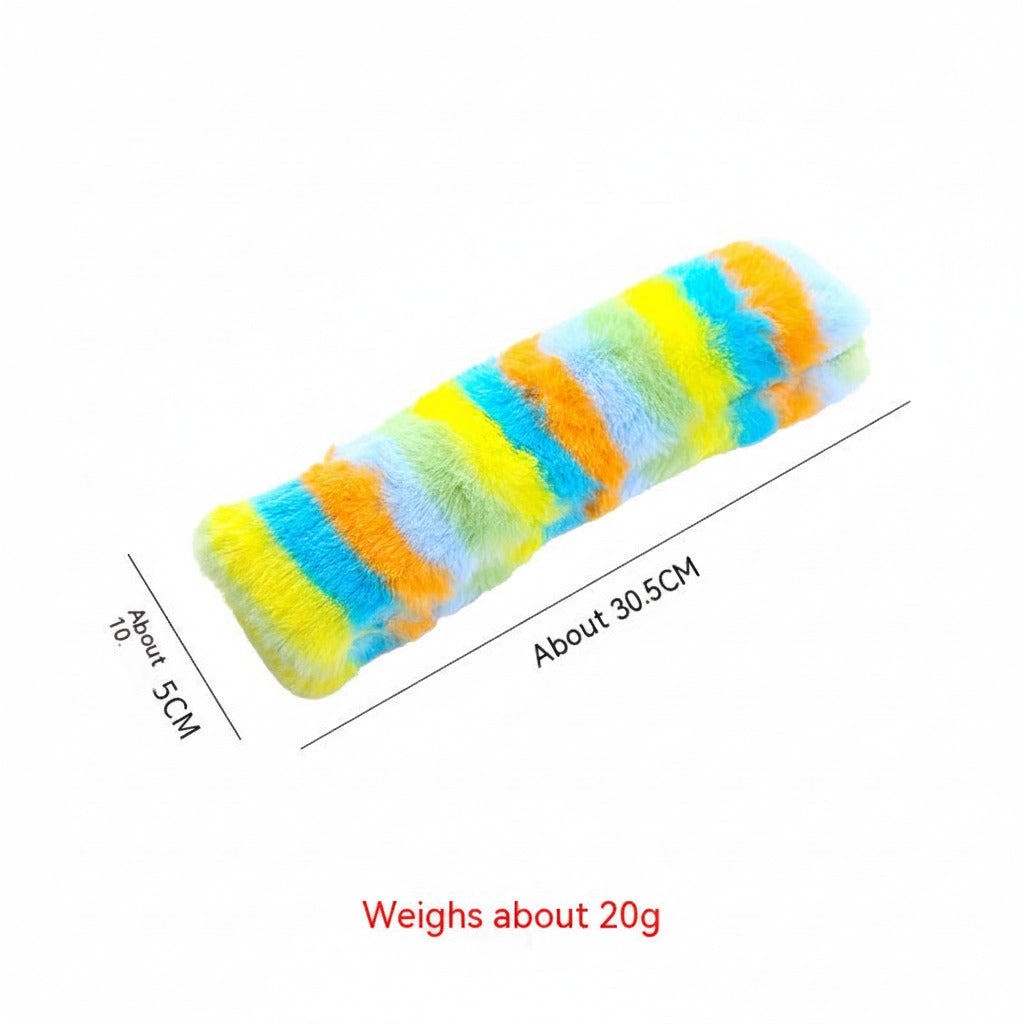 Long plush cat pillow toy with yellow, orange, blue, and green rainbow stripes