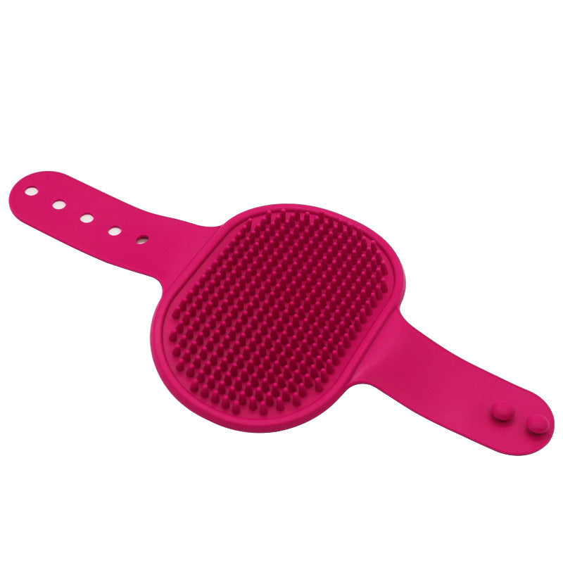 Pink silicone pet grooming brush with raised rubber massage bristles