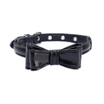 Pet collar with black textured strap and black bow detail, silver grommet studs