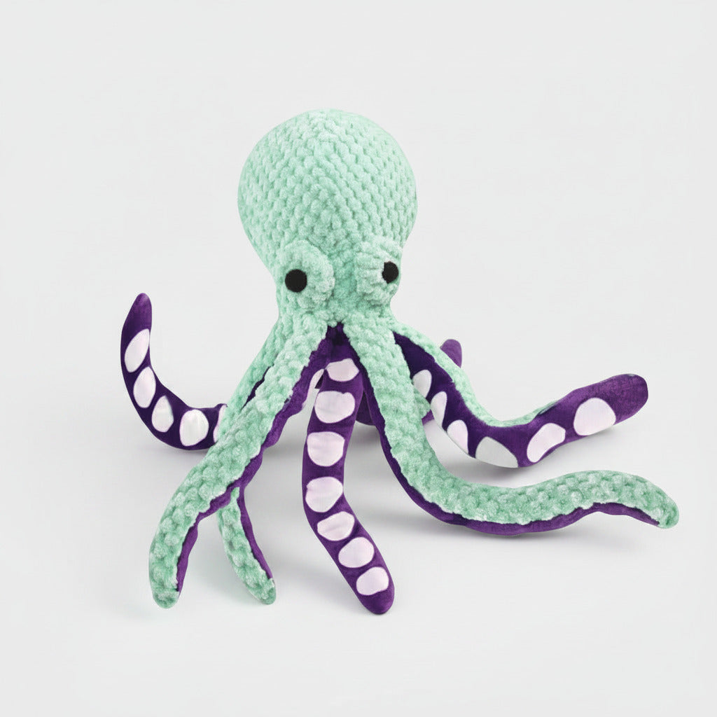 Six-claw fish plush dog toy, mint-green body with purple tentacles