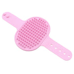 Light pink silicone pet grooming brush with massage nubs and wrist holes